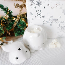 Load image into Gallery viewer, White decorative Christmas Gonk and a Christmas countdown calendar on a textured surface with festive background.