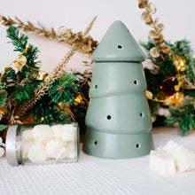 Load image into Gallery viewer, Green ceramic wax melt burner with wax melts on a decorative background