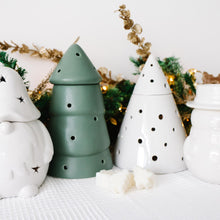 Load image into Gallery viewer, Set of decorative ceramic wax melt burners including a Christmas gonk, tree, and snowman on a white surface with Christmas decorations in the background.