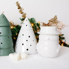 Load image into Gallery viewer, Set of decorative ceramic wax melt burners including a Christmas gonk, tree, and snowman on a white surface with Christmas decorations in the background.