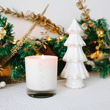 Load image into Gallery viewer, White candle and decorative tree with Christmas decorations on a white surface