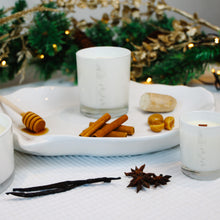 Load image into Gallery viewer, 2 MJM branded candles in white glass jars, surrounded by ingredients that depict the scent such as cinnamon sticks, vanilla pods, ginger, golden syrup & star anise
