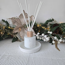 Load image into Gallery viewer, Diffuser with festive decorative elements on a textured wall