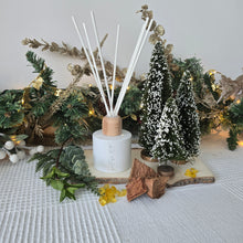 Load image into Gallery viewer, Decorative diffuser with greenery and lights on a textured surface