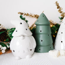 Load image into Gallery viewer, Set of decorative ceramic wax melt burners including a Christmas Gonk, Christmas tree, and snowman on a white surface with Christmas decorations in the background.
