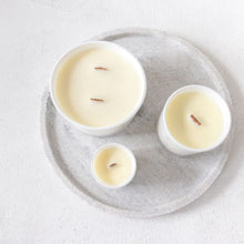 Load image into Gallery viewer, A picture of a large, medium and small candle from  a birds eye view perspective, clearly showing the aesthetic of the wooden wicks  they have been made with 
