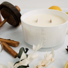 Load image into Gallery viewer, A picture of a large candle surrounded by ingredients that depict the fragrance dark honey &amp; tobacco. The candle has a double wooden wick and is in a white glass vessel with MJM Home Fragrance logo
